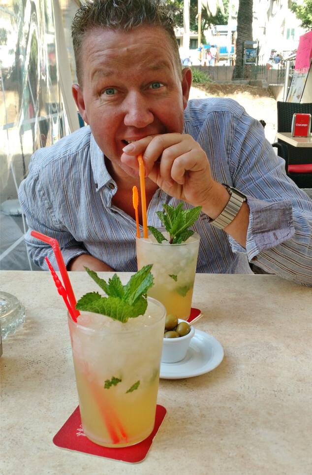Ian drinking a mojito through a straw