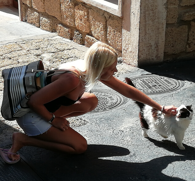 Woman stroking a cat at Jungle Park Tenerife